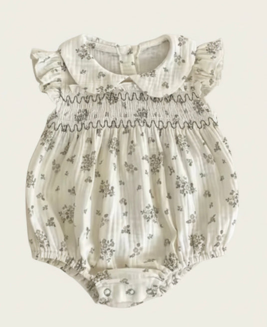 Barboteuse bébé fille fleurie en coton nid d’abeille